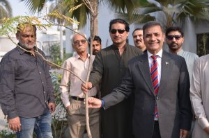 Mr. Kaleem Ullah (Rashid) Khaskheli & his team alongside Dr. Syed Saif Ur Rehman PAS, TI Posing with the tree they planted.