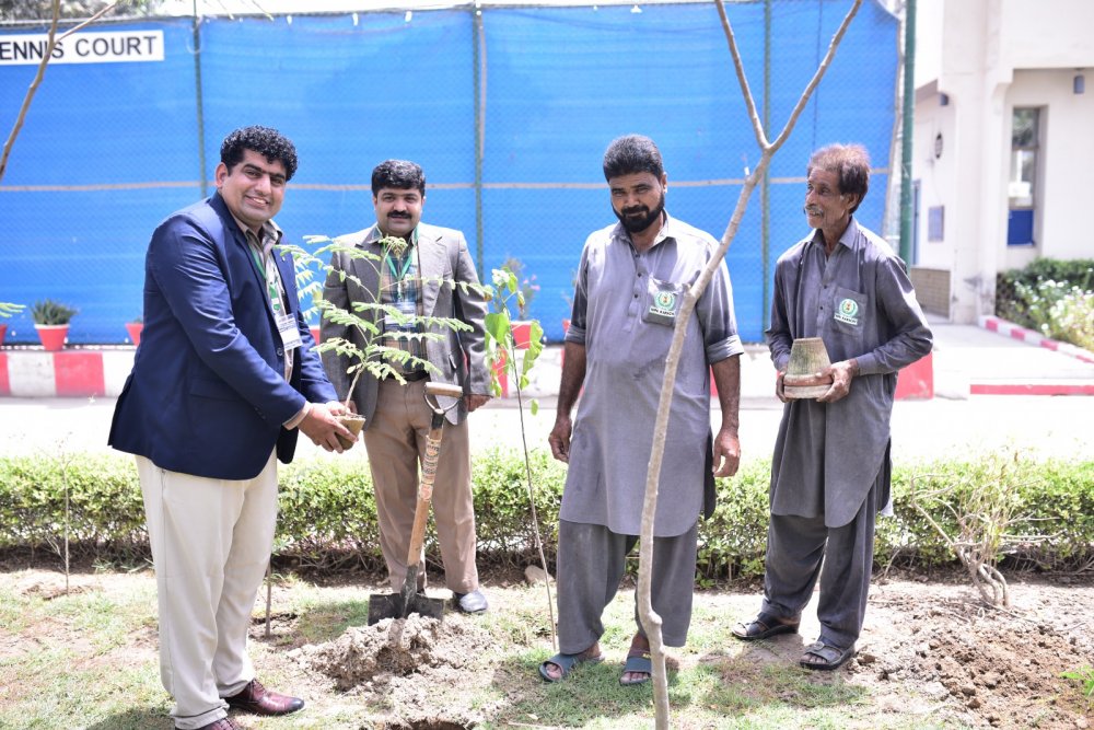 Participants of (ToT) under Faculty Development Program of the Sindh Higher Education Commission (SHEC) planting trees during their course in NIPA Karachi.